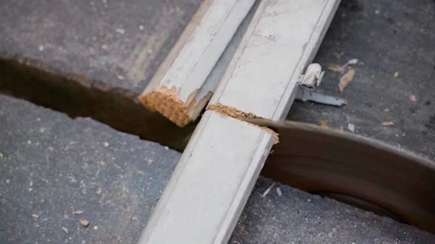 Sawing old wooden window frames with a circular saw. Dull circle of a circular Stock Footage 198867836