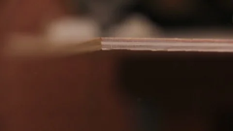 Sawing out with power jigsaw, racking focus to a saw Stock Footage 122203710