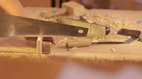 Sawing the plank with a hand saw Video stock 59231815