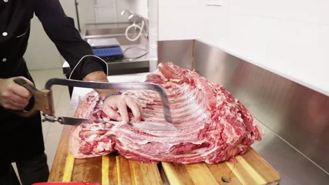 Sawing Pork Rib in the kitchen of a restaurant Stock Footage 248749215