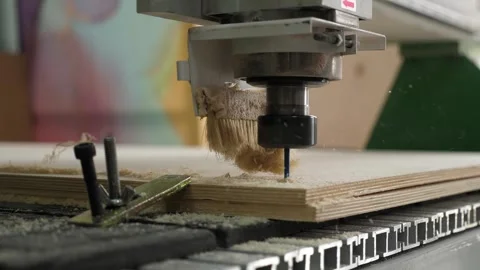 Sawing wood and cleaning the surface with a power tool. Brushes on the drill. Stock Footage 287586604
