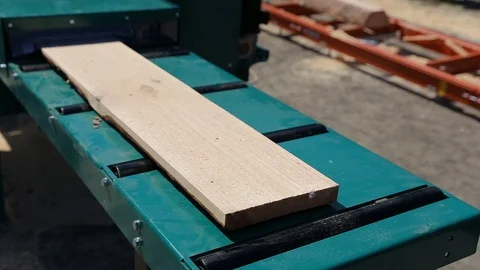 Sawmill. The process of cutting logs into boards Stock Footage 72698753