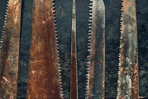Saws on metal surface. Rusty tools for maintenance. Hardware to fix. Techni.. Stock Photos
