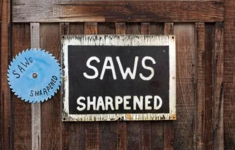 SAWS SHARPENED sign Stock Photos
