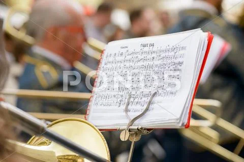 Saxophone and musical score Stock Photos