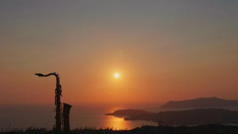 Saxophone on the mountain sunset view Stock Footage 94460647