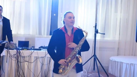 Saxophone player and sound engineer at work 스톡 동영상 82297789