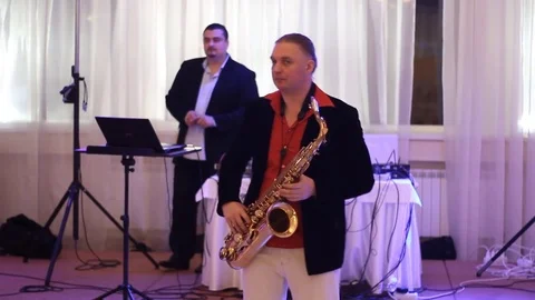 Saxophone player and sound engineer at work Stock Footage 82297943