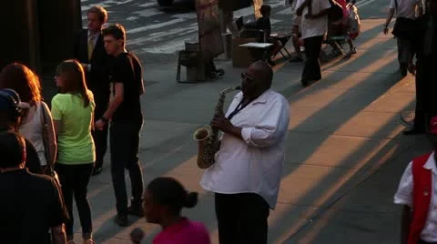 Saxophone player busking on the streets of New York Stock Footage