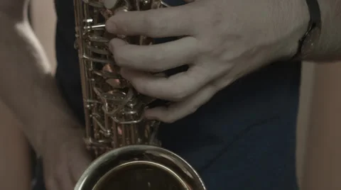 Saxophone player at close angle showing fingers and buttons Stock Footage 38033222