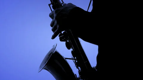 Saxophone player in a color background. Close-up Stock Footage 37142995