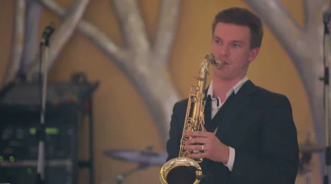 Saxophone player performs on stage. Close up profile shot. Stock Footage 40685448