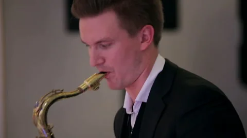 Saxophone player performs on stage. Close up profile shot. Stock Footage 40685737