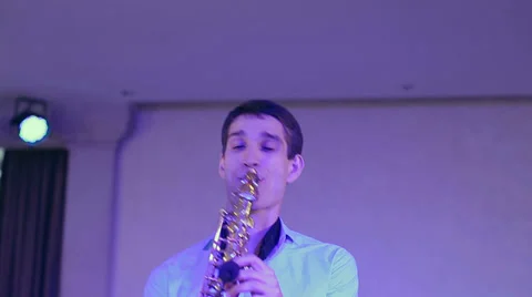 Saxophone player performs on stage with professional light. Close up. Stock Footage 39611517