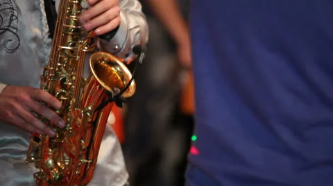 Saxophonist at a party Stock Footage 22915544