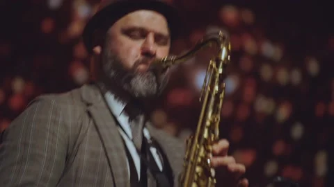 Saxophonist performs, dynamic saxophone playing Stock Footage 231550748