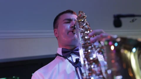 The saxophonist playing on stage Stock Footage 163311828