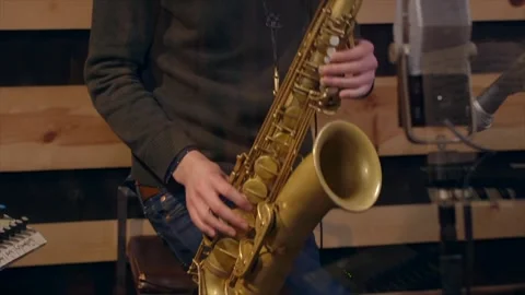 Saxophonist in Recording Studio performing Stock Footage 257944168