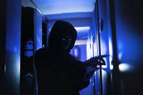 Say goodbye to your private data. a hacker using a digital tablet in a server Stock Photos