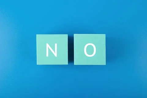 Say no or negative answer minimal concept on blue background. No written on toy Stockfoto's