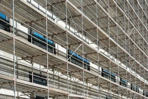 A scaffold on a multi-storey facade of a house Stock Photos