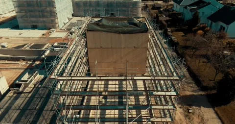 Scaffolded Building under a Protective Tarp, Residential Area, Top Down Drone Stock Footage 340312607