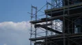 Scaffolding On Building Being Constructed With Clouds Ultra HD Time Lapse 4k or 4k+ Resolution