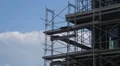 Scaffolding On Building Being Constructed With Clouds HD Vidéos HD