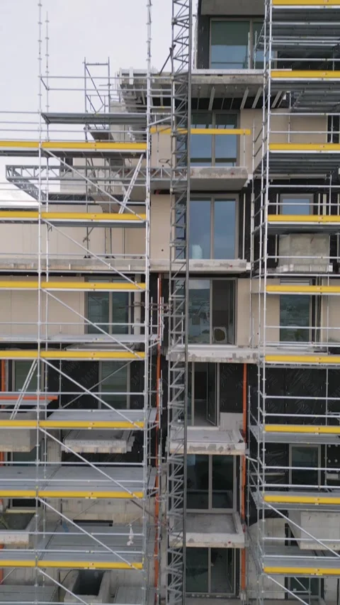 Scaffolding on Building Facade Under Construction for Renovation Work Stock Footage 345157705