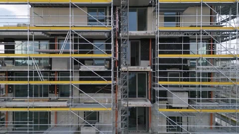 Scaffolding on Building Facade Under Construction for Renovation Work Stock Footage 345157741