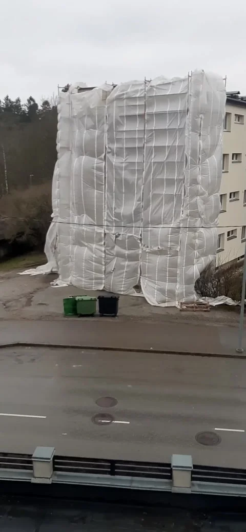 Scaffolding completely blows away from gust of wind Stock Footage 152261466