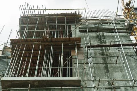Scaffolding on the construction of a concrete multi-storey building Stock Photos