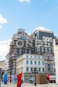 Scaffolding on the facade of a beautiful building on Leningradskaya street Stock Photos