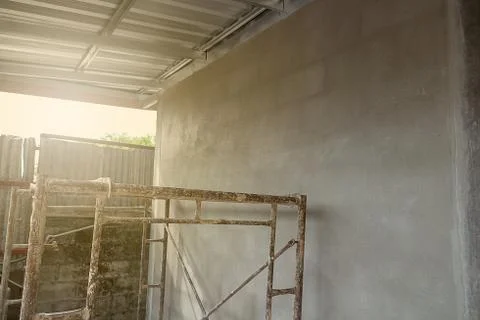 Scaffolding iron concrete wall in construct site at morning Stock Photos