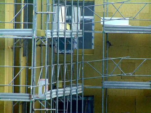 Scaffolding mounted on a wall for insulation work Fotos Stock