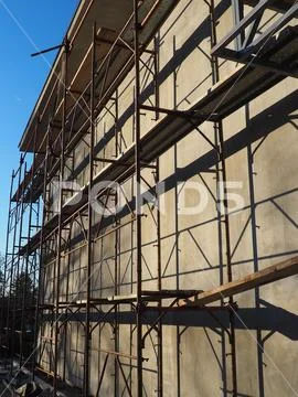 Scaffolding On A New One-story House. Facade Works. Building Bussiness 