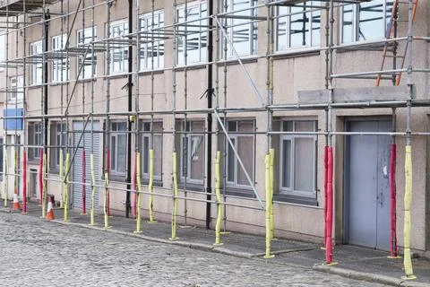 Scaffolding surrounding house development for safe access to construction work Stock Photos