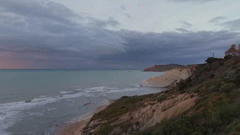 Scala dei Turchi white cliffs and stormy sea in Sicily at sunrise Stock Footage 346611089