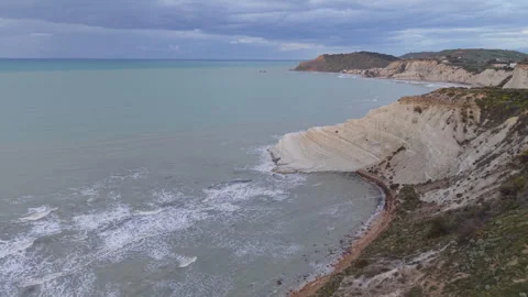 Scala dei Turchi white cliffs in Sicily on a cloudy morning Stock Footage 346652415