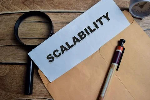 Scalability text on document above brown envelope. Stock Photos