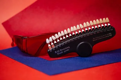 A scale for checking the color of teeth in close-up. Cosmetic dentistry Stock Photos