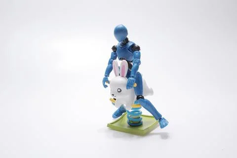 The scale figure with rabbit animal of Spring see saw Stock Photos