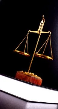 Scale of justice on a book Stock Photos