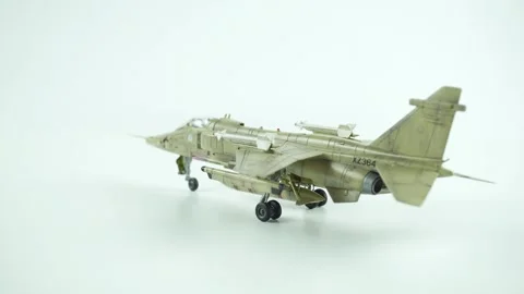Scale Model Of Jaguar Airplane With Desert Camouflage On White Background. Stock Footage 305407216
