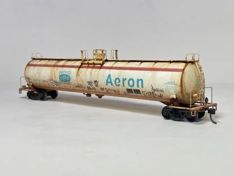 Scale model LPG tanker wagon with detailed custom weathering and graffiti Stock Photos
