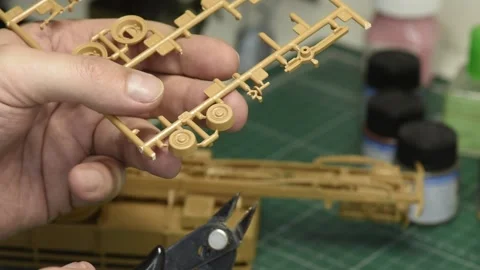 Scale Modeling. A man is assembling a plastic car model kit. 스톡 동영상 158664020