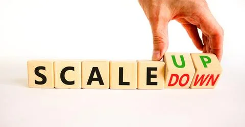 Scale up or down symbol. Concept words Scale up Scale down wooden cubes. Bu.. Stock Photos