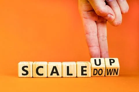 Scale up or down symbol. Concept words Scale up Scale down wooden cubes. Bu.. Stock Photos