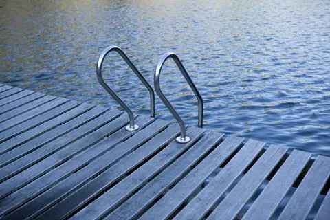 Scale on the pontoon of a lake Stock Photos