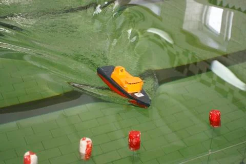 Scale ship model floating in the pool Stock Photos